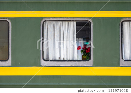 Green Train Carriage Window With White Curtains And Red Roses Inside Green Train Carriage Window With White Curtains And Red Roses Inside 131971028