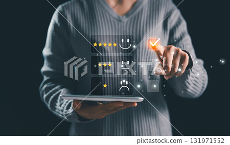 Business person selecting five-star rating with virtual interface, concept of online customer feedback, satisfaction survey, digital marketing, reputation management and service quality evaluation. Business person selecting five-star rating with virtual interface, concept of online customer feedback, satisfaction survey, digital marketing, reputation management and service quality evaluation. 131971552