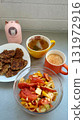 Delicious breakfast spread featuring healthy pancakes, fresh salad, tea, and coffee in a cozy kitchen setting 131972916