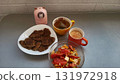 Delicious homemade breakfast with lentil patties, fresh salad, and tea on a cozy table 131972918