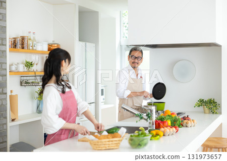 Kitchen: Middle-aged couple cooking 131973657