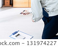 A man in work clothes checking furniture 131974227