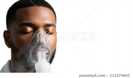 African American man receiving respiratory therapy with a nebulizer mask. Patient with asthma or breathing problems getting medical treatment. Isolated on a white background with copy space African American man receiving respiratory therapy with a nebulizer mask. Patient with asthma or breathing problems getting medical treatment. Isolated on a white background with copy space 131974605