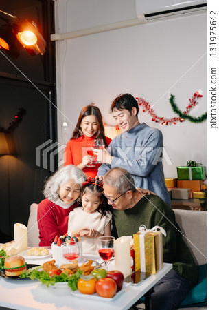 Celebrate Christmas with family in a cozy, festive setting filled with gifts, love, and joy. Celebrate Christmas with family in a cozy, festive setting filled with gifts, love, and joy. 131975642