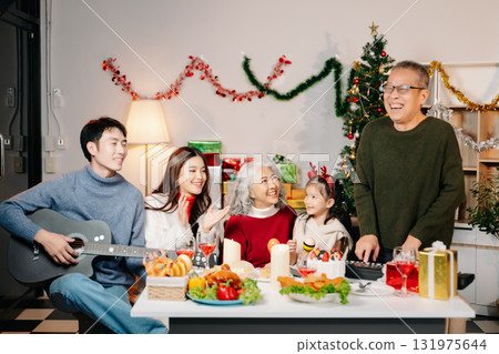 Celebrate Christmas with family in a cozy, festive setting filled with gifts, love, and joy. Celebrate Christmas with family in a cozy, festive setting filled with gifts, love, and joy. 131975644
