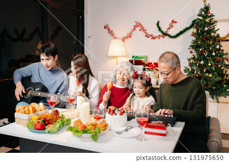 Celebrate Christmas with family in a cozy, festive setting filled with gifts, love, and joy. Celebrate Christmas with family in a cozy, festive setting filled with gifts, love, and joy. 131975650