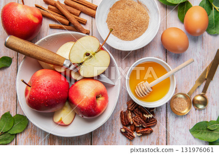 Baking ingredients for apple dessert on wooden table 131976061