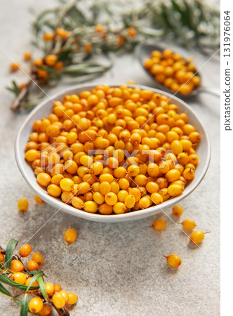 Sea buckthorn berries in bowl healthy eating concept Sea buckthorn berries in bowl healthy eating concept 131976064
