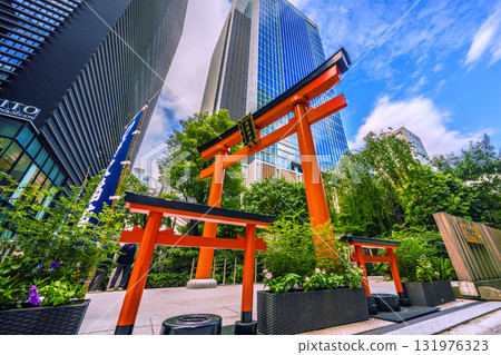 Tokyo cityscape in Japan, with views of Fukutoku Shrine and other shrines in the valley between buildings in Nihonbashi Muromachi 131976323