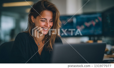 Smiling investor checking positive stock data on laptop 131977077