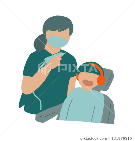 Boy wearing earmuffs undergoing dental treatment 131979510