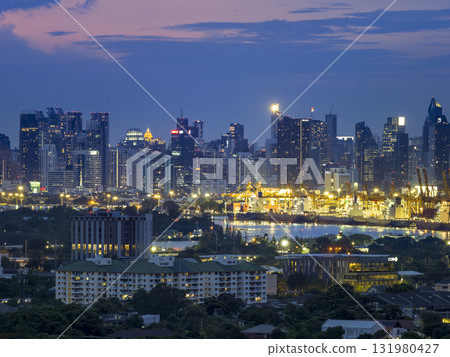 Bangkok, Thailand - Skyscrapers and industrial areas along the Chao Phraya River 131980427