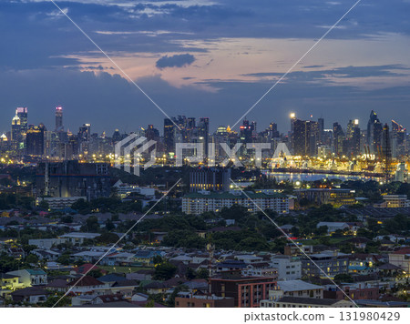 Bangkok, Thailand - Skyscrapers and industrial areas along the Chao Phraya River 131980429