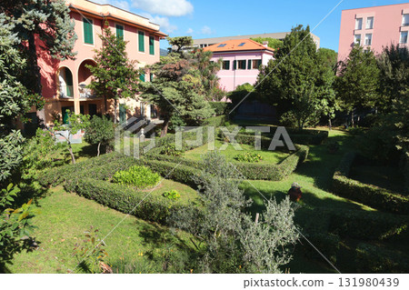 Old traditional buildings and park garden in Italian countryside. Sunny day. Entrance, window to house. Nature and sky Old traditional buildings and park garden in Italian countryside. Sunny day. Entrance, window to house. Nature and sky 131980439