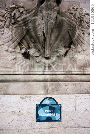 Pont Alexandre III bridge name plaque and stone sculpture in Paris, France 131980869