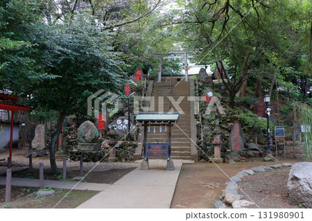Komagome Fuji Jinja in Bunkyo-ku Tokyo Japan is a Shinto Shrine on a manmade hill called a Fujizaka using rocks from Mt. Fuji, founded around 1573 and dedicated to Japanese firefighters. Komagome Fuji Jinja in Bunkyo-ku Tokyo Japan is a Shinto Shrine on a manmade hill called a Fujizaka using rocks from Mt. Fuji, founded around 1573 and dedicated to Japanese firefighters. 131980901