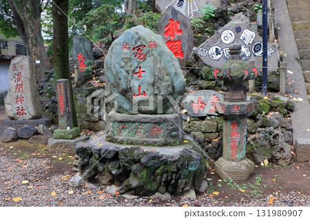 Komagome Fuji Jinja in Bunkyo-ku Tokyo Japan is a Shinto Shrine on a manmade hill called a Fujizaka using rocks from Mt. Fuji, founded around 1573 and dedicated to Japanese firefighters. Komagome Fuji Jinja in Bunkyo-ku Tokyo Japan is a Shinto Shrine on a manmade hill called a Fujizaka using rocks from Mt. Fuji, founded around 1573 and dedicated to Japanese firefighters. 131980907