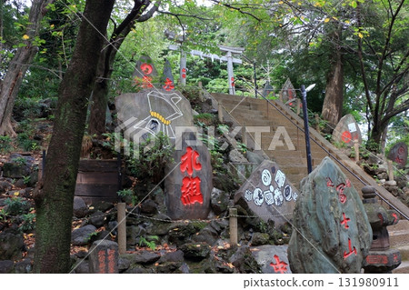 Komagome Fuji Jinja in Bunkyo-ku Tokyo Japan is a Shinto Shrine on a manmade hill called a Fujizaka using rocks from Mt. Fuji, founded around 1573 and dedicated to Japanese firefighters. Komagome Fuji Jinja in Bunkyo-ku Tokyo Japan is a Shinto Shrine on a manmade hill called a Fujizaka using rocks from Mt. Fuji, founded around 1573 and dedicated to Japanese firefighters. 131980911