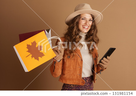 Smiling Woman in Autumn Fashion with Shopping Smiling Woman in Autumn Fashion with Shopping 131981154