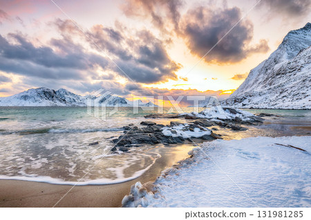 Unbeliveble winter view of Vik beach during sunset with lots of snow and snowy mountain peaks near Leknes. Unbeliveble winter view of Vik beach during sunset with lots of snow and snowy mountain peaks near Leknes. 131981285
