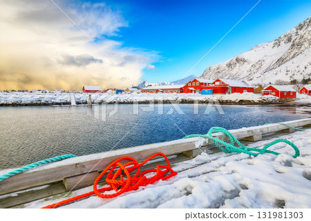 Unbelivable winter sunrise over Ramberg village and harbour. 131981303