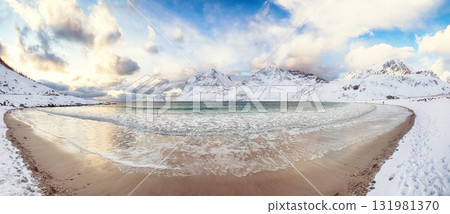 Amazing winter view of Vik beach during sunset with lots of snow and snowy mountain peaks near Leknes. Amazing winter view of Vik beach during sunset with lots of snow and snowy mountain peaks near Leknes. 131981370