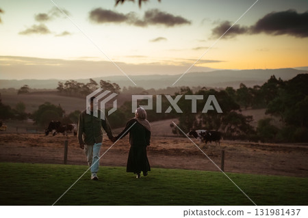 A Beautiful and Romantic Sunset Stroll Through the Countryside Fields 131981437