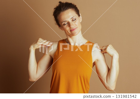 Woman Massaging Shoulders for Stress Relief 131981542