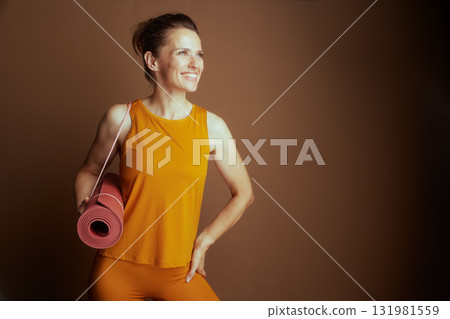 Smiling Woman Ready for Yoga Session 131981559