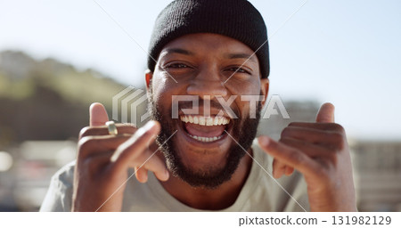 Portrait, energy and hand gesture with a black man in the city for freedom outdoor during summer. Face, smile and excited with a happy young person on a roof in an urban town to sign an expression Portrait, energy and hand gesture with a black man in the city for freedom outdoor during summer. Face, smile and excited with a happy young person on a roof in an urban town to sign an expression 131982129