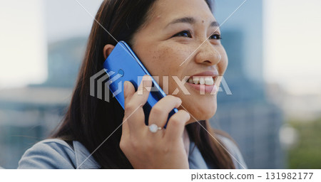 Face, smile and phone call with a business asian woman in the city for work travel while networking. Vision, communication and a happy young female employee talking on her mobile in Singapore Face, smile and phone call with a business asian woman in the city for work travel while networking. Vision, communication and a happy young female employee talking on her mobile in Singapore 131982177