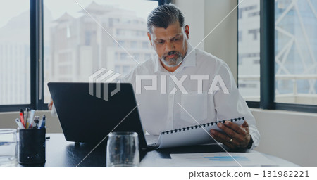Laptop, office and business man with documents for financial report, data analysis and research. Corporate, computer and worker reading paperwork for finance, accounting and company savings review Laptop, office and business man with documents for financial report, data analysis and research. Corporate, computer and worker reading paperwork for finance, accounting and company savings review 131982221