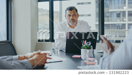 Laptop, team or mature businessman in collaboration with business people planning strategy together. Brainstorming, leader or senior manager talking or speaking of financial info or report in meeting 131982223