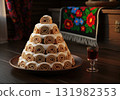 Traditional Moldovan dessert Guguta's Hat a pyramid cake made of sweet pancake rolls 131982353