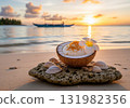 Nauruan coconut pudding in a coconut shell on a tropical beach with a beautiful sunset 131982356
