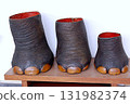 Stuffed elephant's foot 131982374