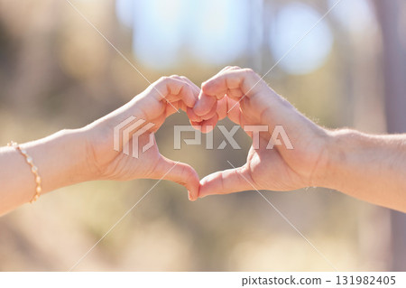 Heart hands, nature and love, support and commitment partnership for marriage outdoors. Valentines day, romance and couple, man and woman with emoji for care, relationship and affection or trust. Heart hands, nature and love, support and commitment partnership for marriage outdoors. Valentines day, romance and couple, man and woman with emoji for care, relationship and affection or trust. 131982405