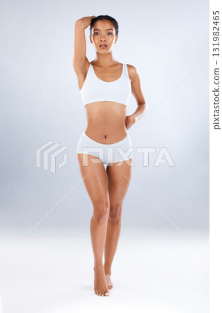 Health, beauty and underwear, portrait of woman with healthy diet, exercise and balance in studio. Fitness, nutrition and body or skincare, model with slim and fit figure isolated on grey background. Health, beauty and underwear, portrait of woman with healthy diet, exercise and balance in studio. Fitness, nutrition and body or skincare, model with slim and fit figure isolated on grey background. 131982465