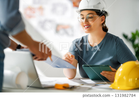 Team of architects working on plans Team of architects working on plans 131982784