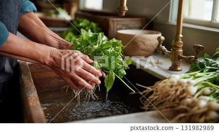 Hands washing fresh green vegetables under running water in a rustic kitchen sink Hands washing fresh green vegetables under running water in a rustic kitchen sink 131982989