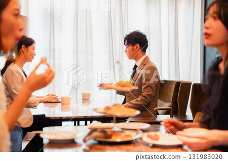People relaxing in a hotel lounge 131983020