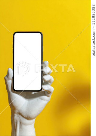 Mockup of a smartphone with a white screen in the hand of an antique statue on a yellow background. 131983388