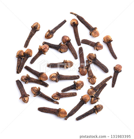 Dried cloves on white background. Bunch of aromatic flower buds of the tree Syzygium aromaticum, used as spice, flavoring, or fragrance, in cuisine, cosmetic products, etc. Close-up, from above. Photo 131983395