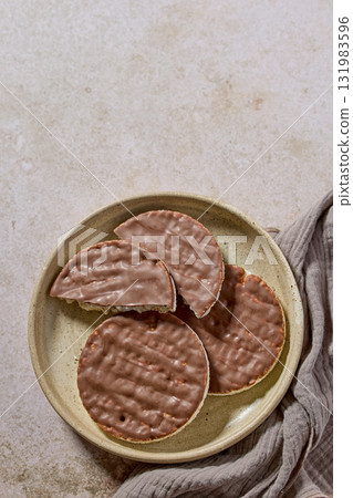 plate of rice galettes cakes cookies covered with milk chocolate plate of rice galettes cakes cookies covered with milk chocolate 131983596