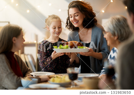 Family celebrating Thanksgiving Day 131983650