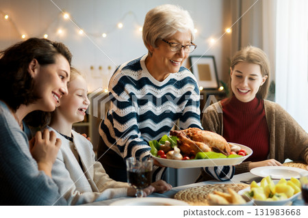 Family celebrating Thanksgiving Day 131983668