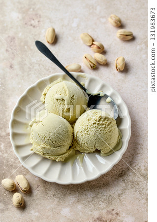 pistachio ice cream scoops on beige plate pistachio ice cream scoops on beige plate 131983673