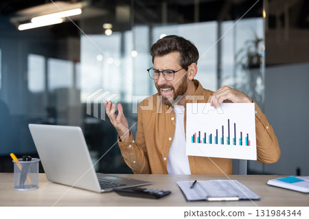 Frustrated entrepreneur reacting to negative financial data while discussing business problems during an online video conference from a modern office workspace Frustrated entrepreneur reacting to negative financial data while discussing business problems during an online video conference from a modern office workspace 131984344