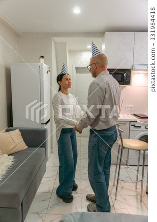 Couple Birthday Party Apartment: Celebrating Anniversary, intimate home dance, happy couple. Couple Birthday Party Apartment: Celebrating Anniversary, intimate home dance, happy couple. 131984418