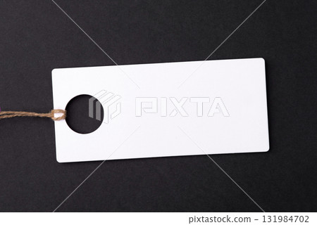 Empty white tag on black background Empty white tag on black background 131984702